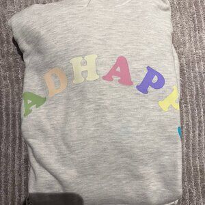 Madhappy grey hoodie and colored madhappy letters.